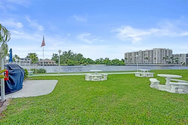 a view of a swimming pool and a yard