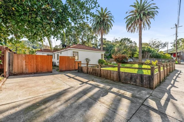 a view of a backyard with swimming pool