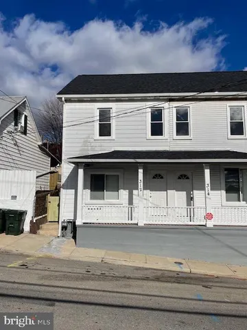 a front view of a house with a space