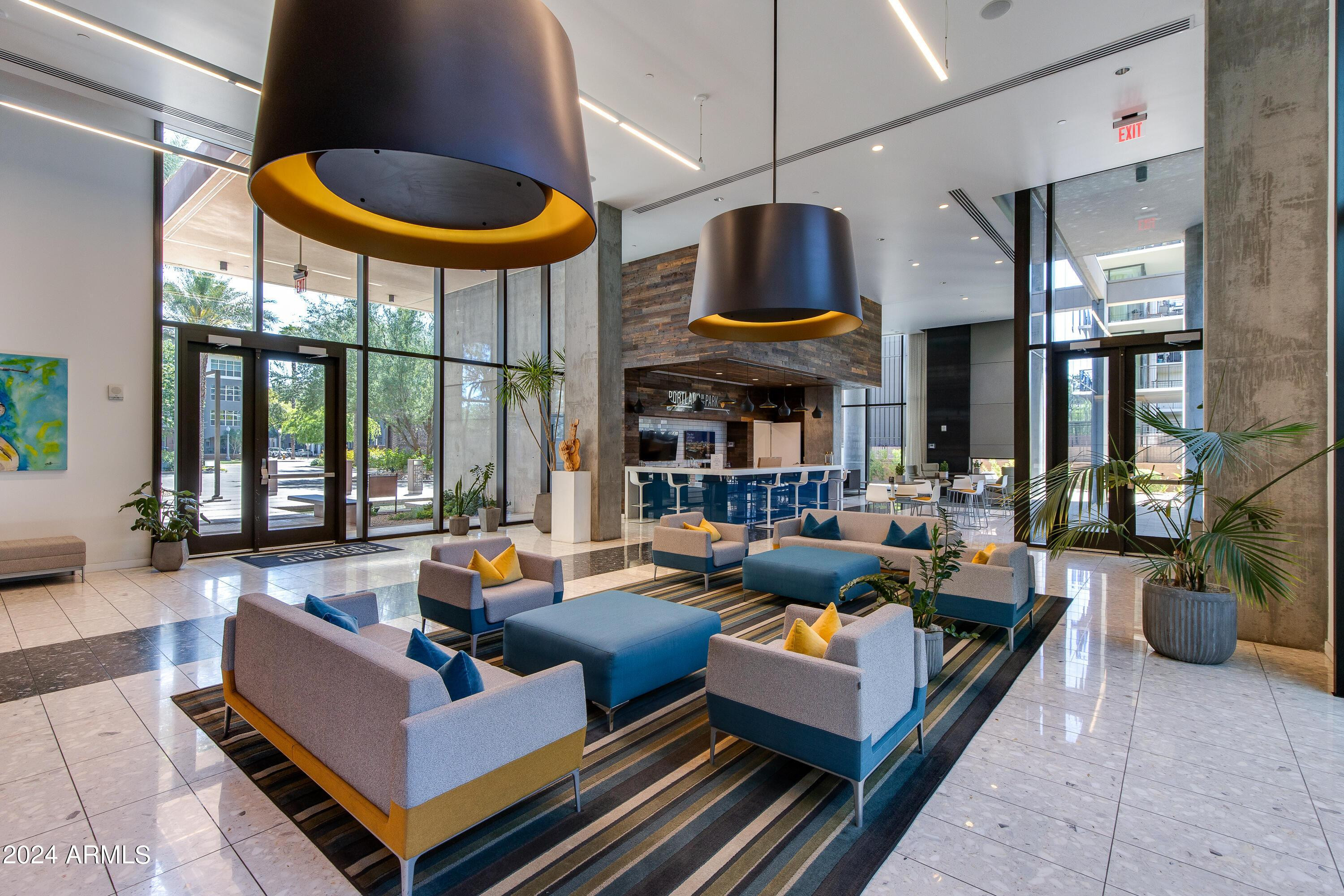 200 West Portland Street, Unit 511 Phoenix, AZ 85003 - Photo 13 of 20 a living room with fireplace furniture and a large window