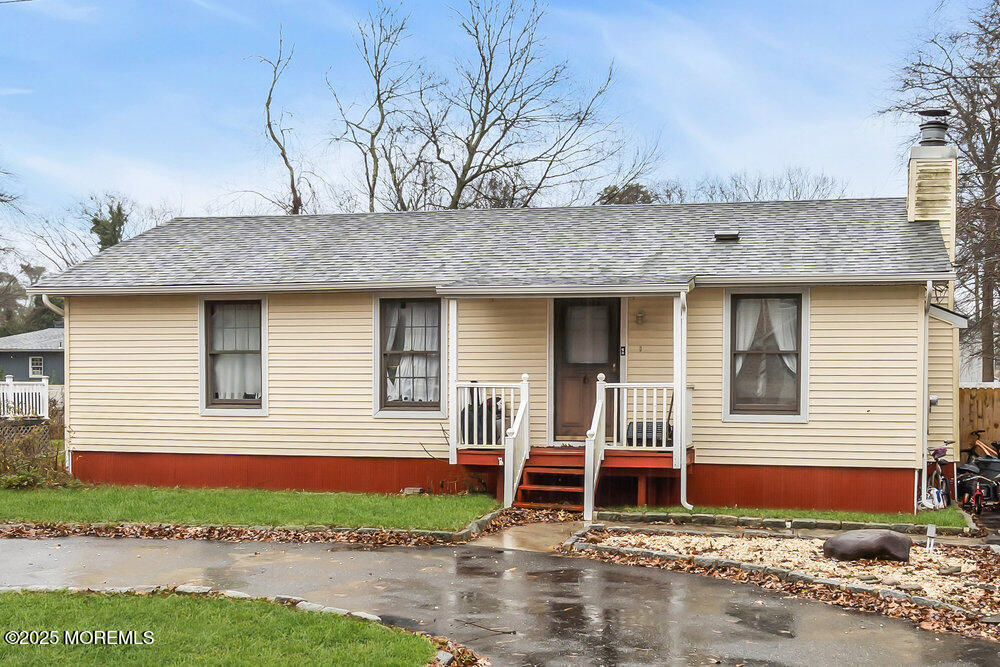 6 Mizzen Way Waretown, NJ 08758 - Photo 1 of 12 a front view of a house with garden