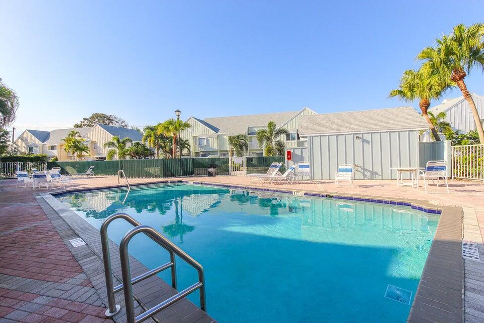 6335 Riverwalk Lane, Unit 3 Jupiter, FL 33458 - Photo 19 of 20 a view of swimming pool with outdoor seating and city view