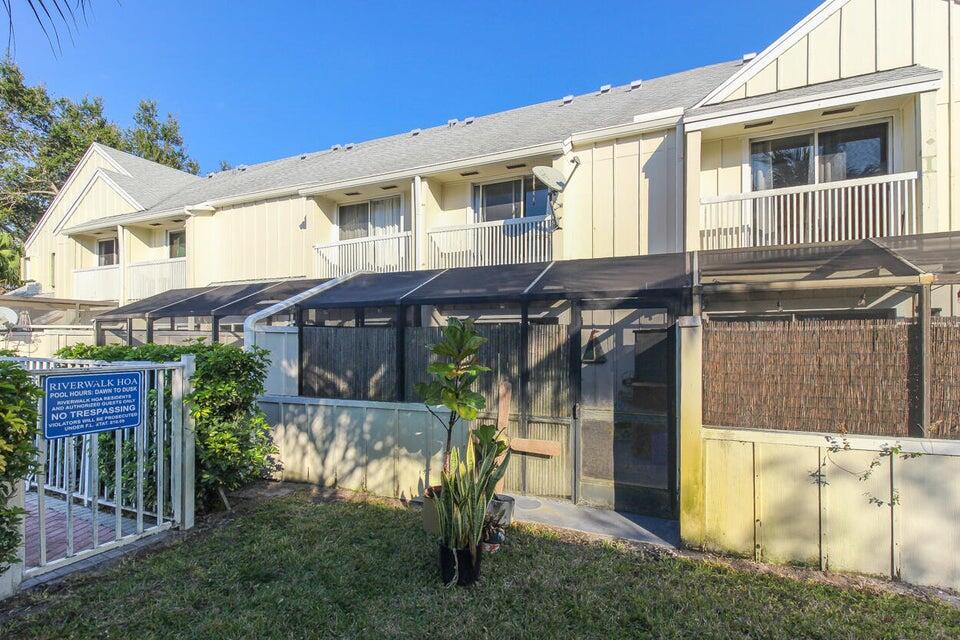 6335 Riverwalk Lane, Unit 3 Jupiter, FL 33458 - Photo 20 of 20 a view of house with a yard