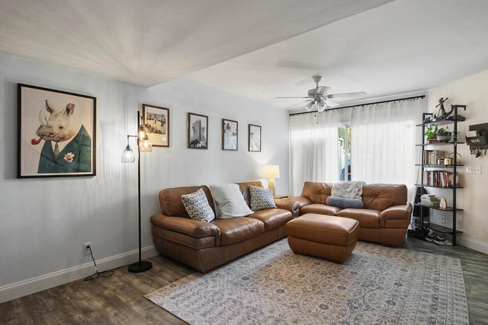 6335 Riverwalk Lane, Unit 3 Jupiter, FL 33458 - Photo 2 of 20 a living room with furniture and a couch