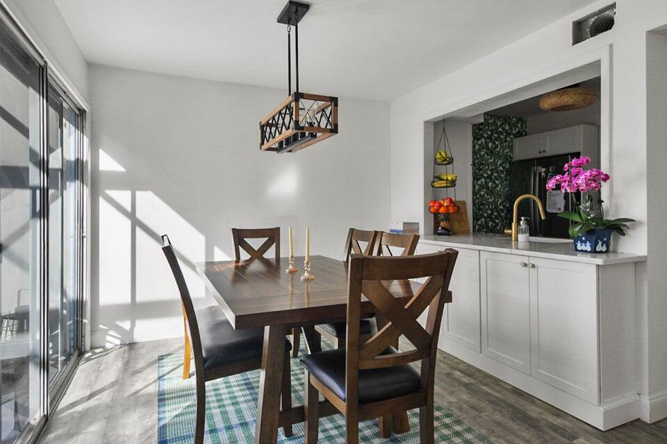 6335 Riverwalk Lane, Unit 3 Jupiter, FL 33458 - Photo 5 of 20 a view of a dining room with furniture window and outside view