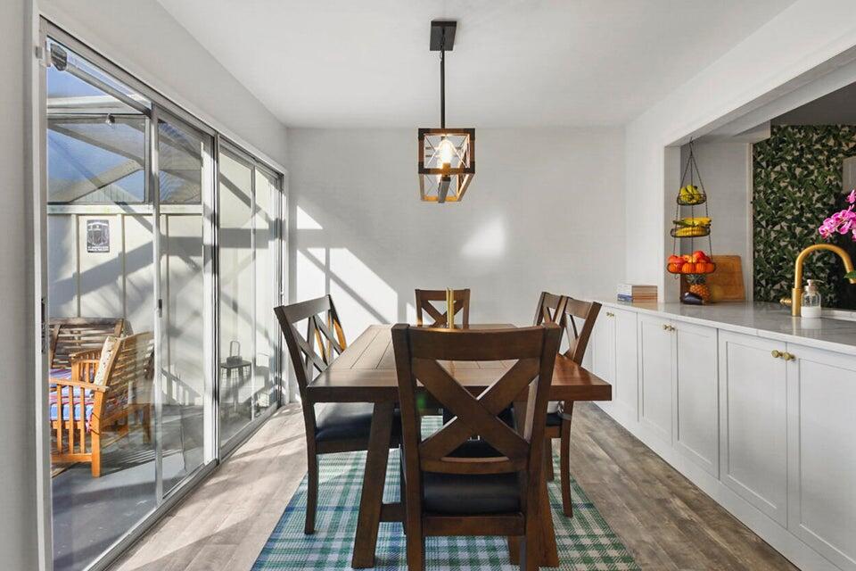 6335 Riverwalk Lane, Unit 3 Jupiter, FL 33458 - Photo 6 of 20 a dining room with furniture and window