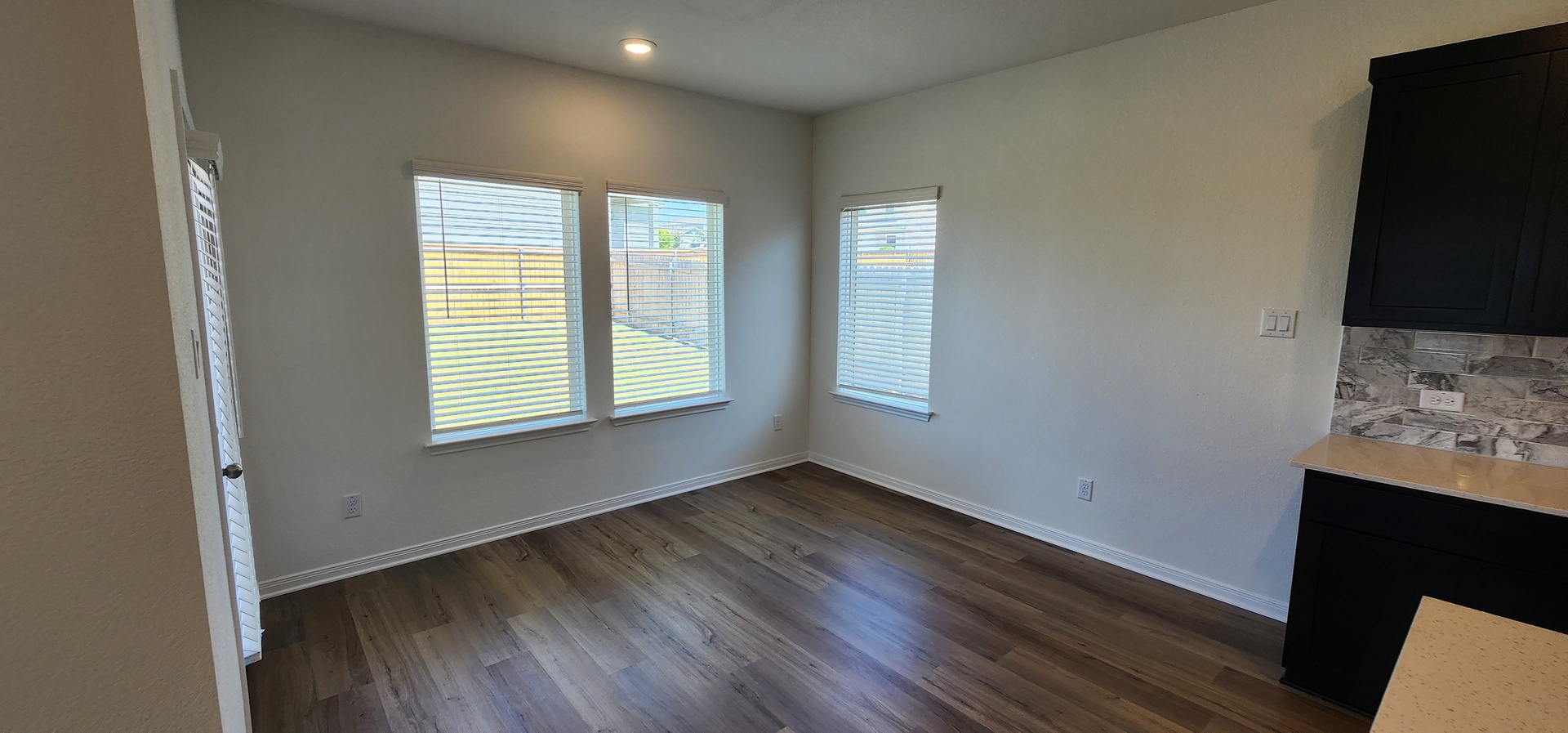 504 Yellow Ribbon Trail Jarrell, TX 76537 - Photo 4 of 8 Vinyl plank flooring extends throughout this naturally illuminated space with views of the private backyard.