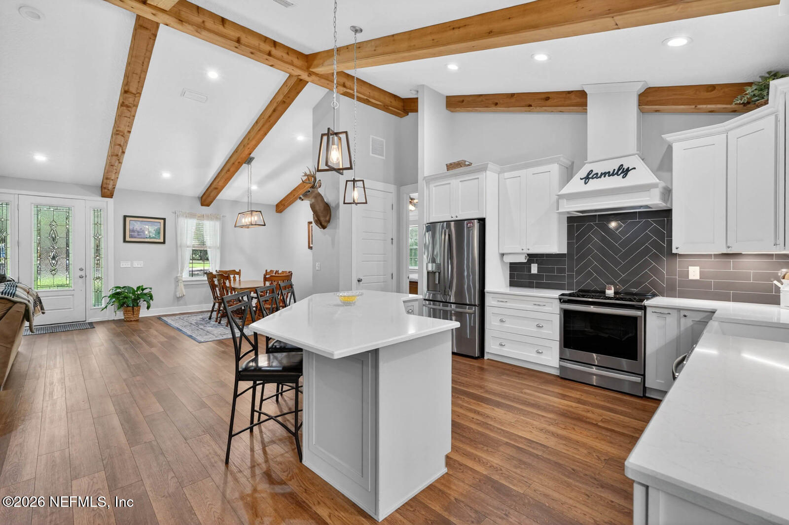 264 Peniel Church Road Palatka, FL 32177 - Photo 13 of 48 a kitchen with granite countertop a stove and a wooden floor