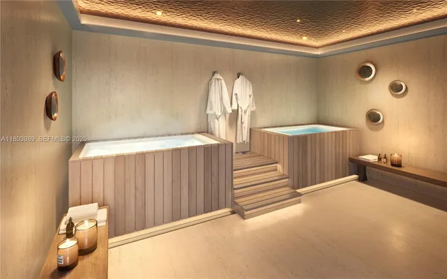 a view of a livingroom with wooden floor and a large window