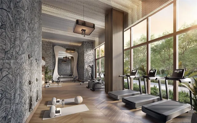 a living room with furniture and large windows