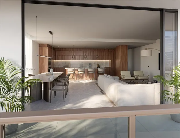 a living room with furniture and potted plant