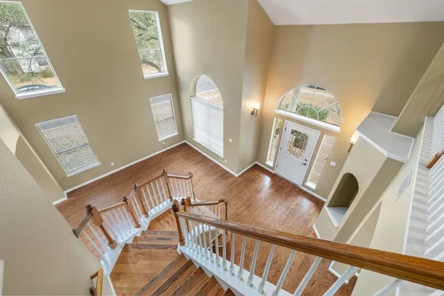 a view of living room and dining room with wooden floor