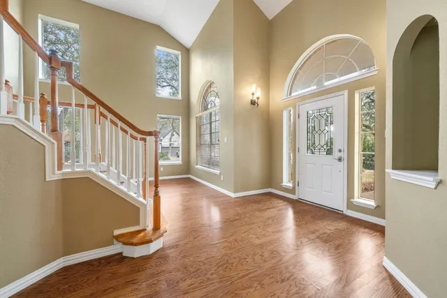 a view of an entryway with wooden floor