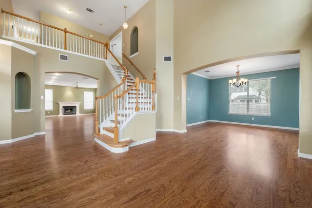a view of an entryway with wooden floor and door