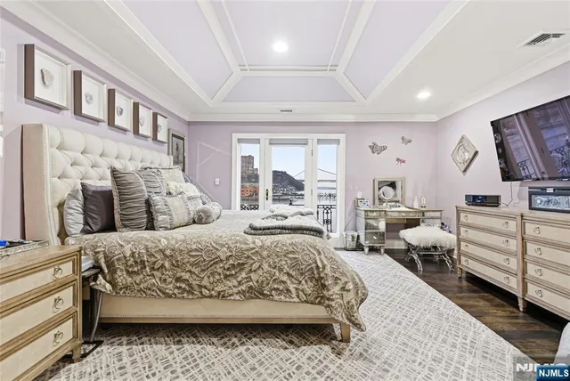 a bedroom with a large bed and furniture