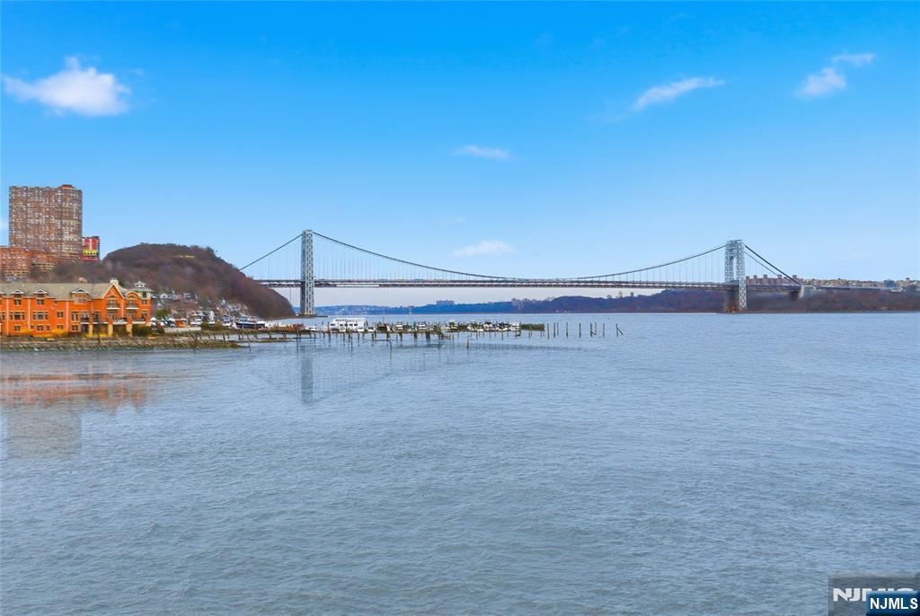 119 Hudson Cove Edgewater, NJ 07020 - Photo 26 of 44 a view of an ocean with boats and trees in the background