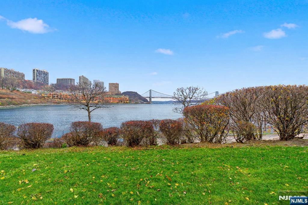 119 Hudson Cove Edgewater, NJ 07020 - Photo 43 of 44 a view of a lake with houses in the back