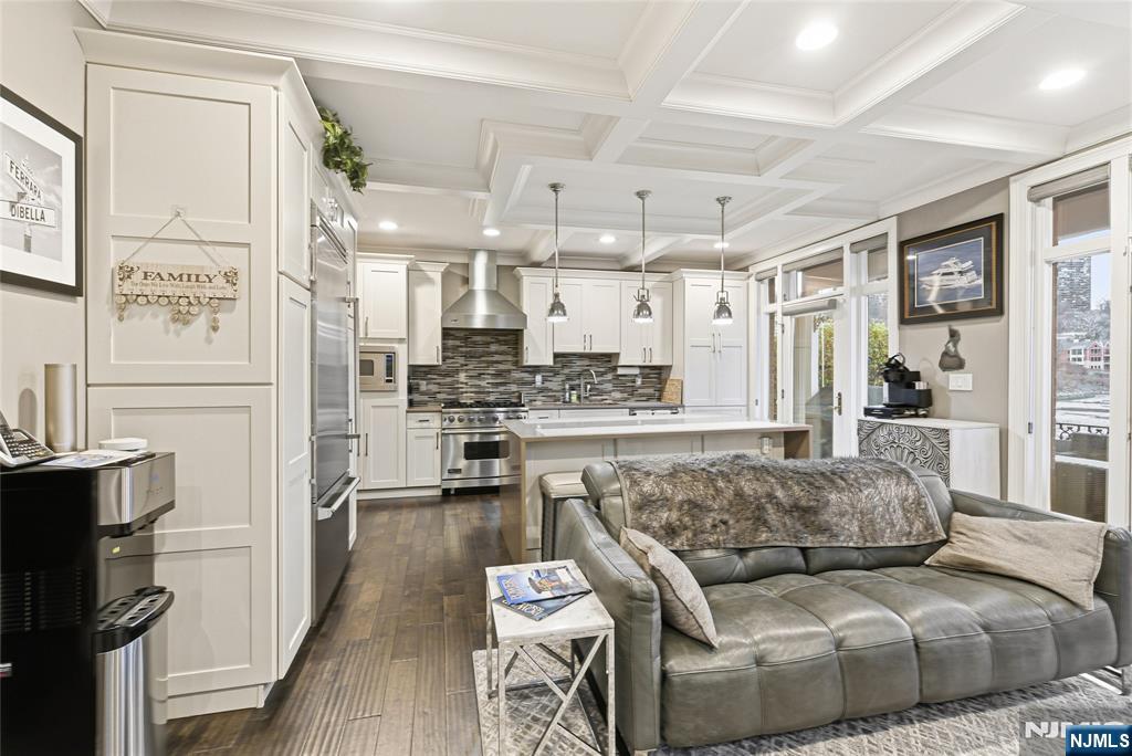 119 Hudson Cove Edgewater, NJ 07020 - Photo 9 of 44 a living room with furniture and a wooden floor