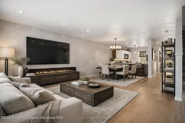a living room with furniture and a flat screen tv