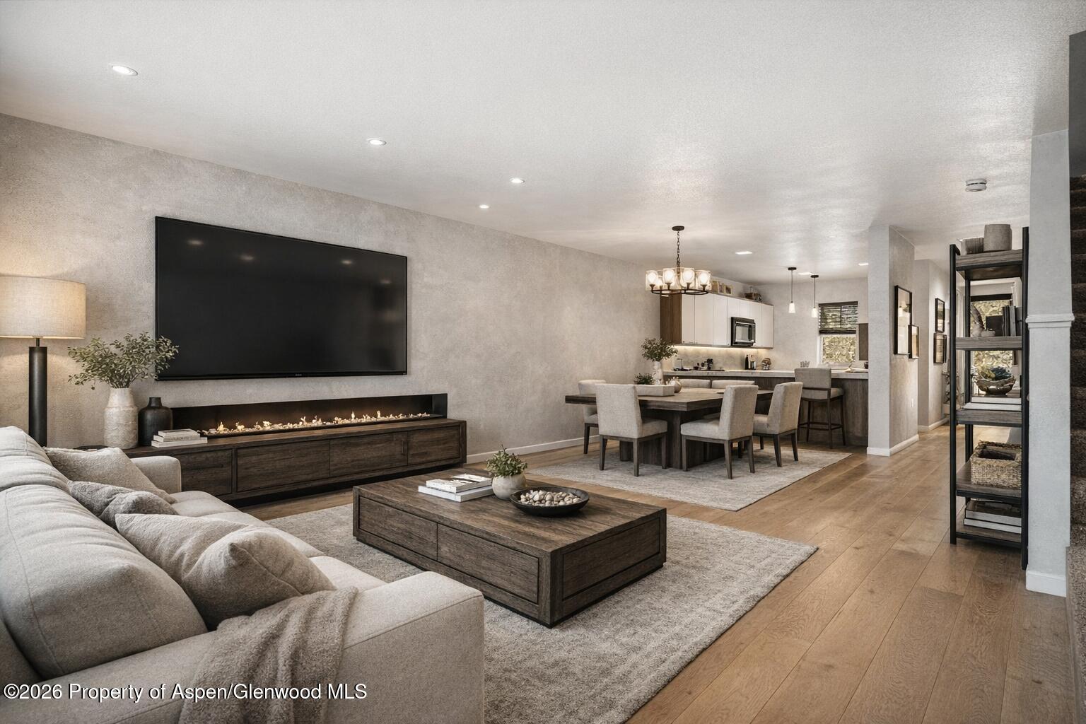323 Park Avenue, Unit G2 Basalt, CO 81621 - Photo 1 of 25 a living room with furniture and a flat screen tv