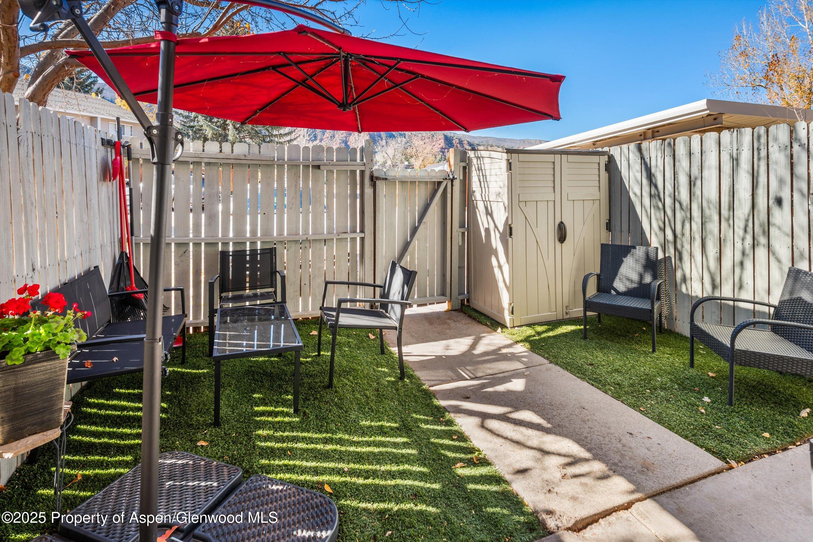 323 Park Avenue, Unit G2 Basalt, CO 81621 - Photo 11 of 17 a view of a backyard with sitting area