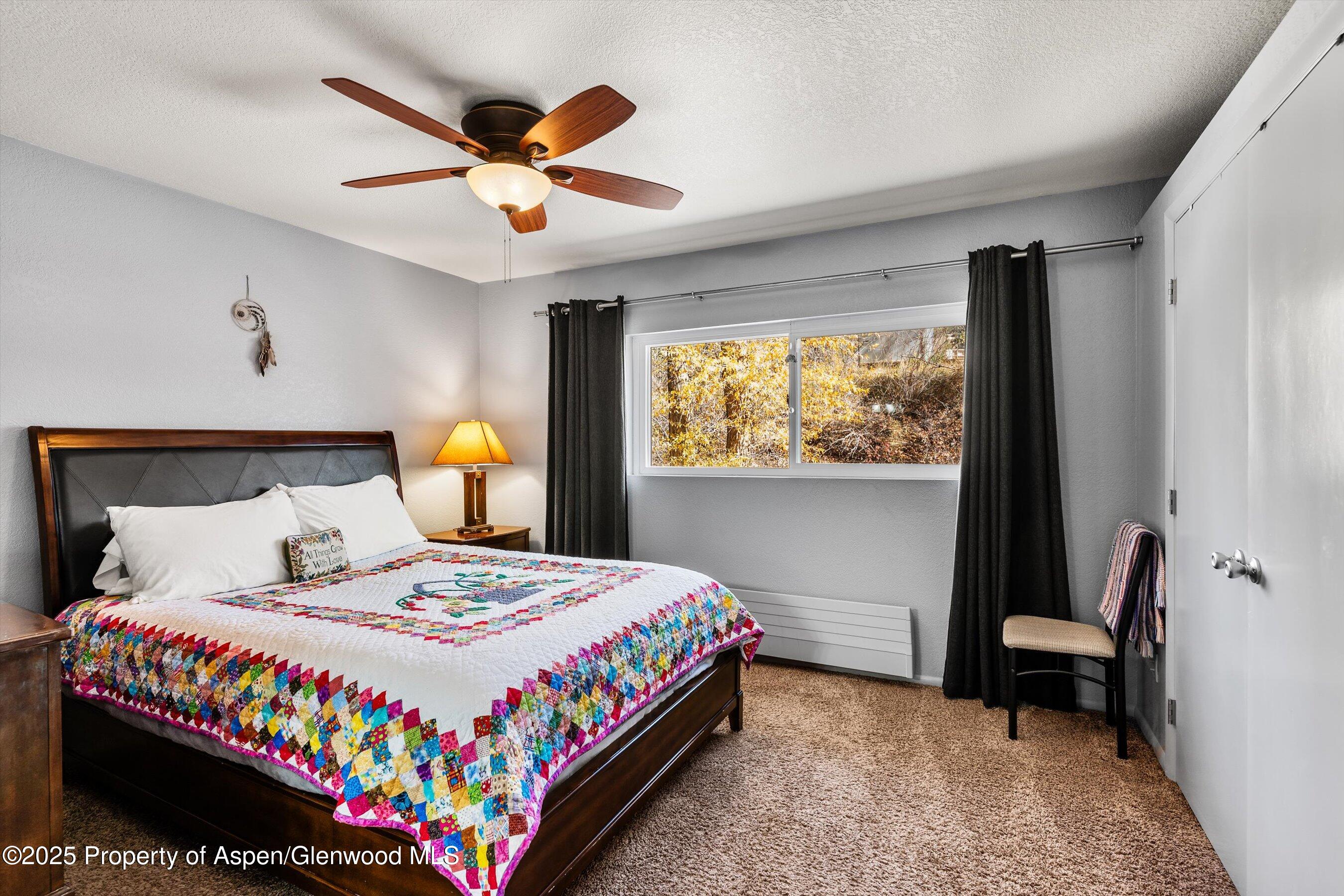 323 Park Avenue, Unit G2 Basalt, CO 81621 - Photo 15 of 25 a bedroom with a bed and a window