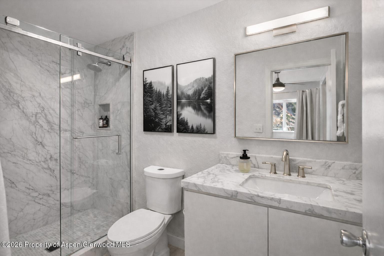 323 Park Avenue, Unit G2 Basalt, CO 81621 - Photo 6 of 25 a bathroom with a granite countertop sink toilet and shower