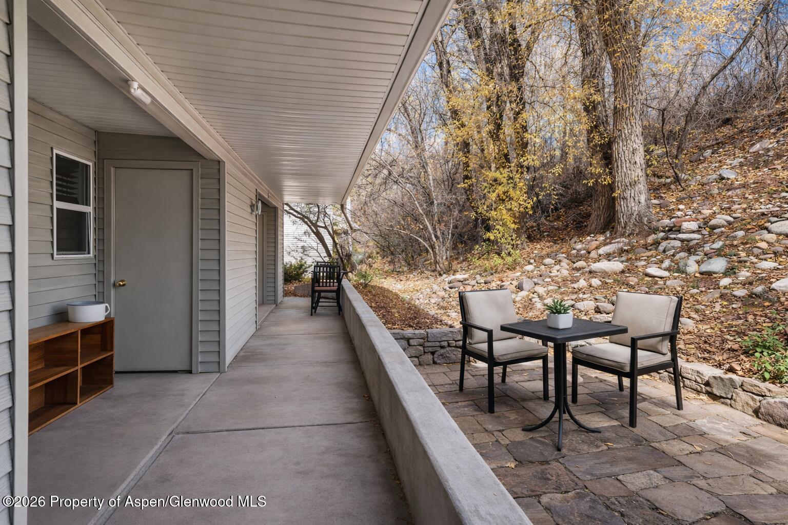 323 Park Avenue, Unit G2 Basalt, CO 81621 - Photo 8 of 25 a view of a patio with table and chairs and potted plants