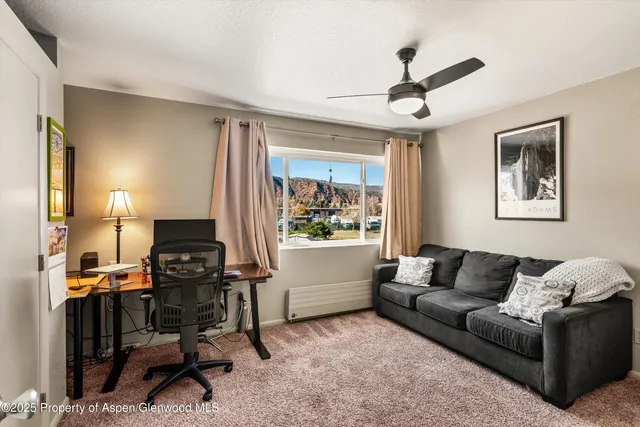 a living room with furniture and a window