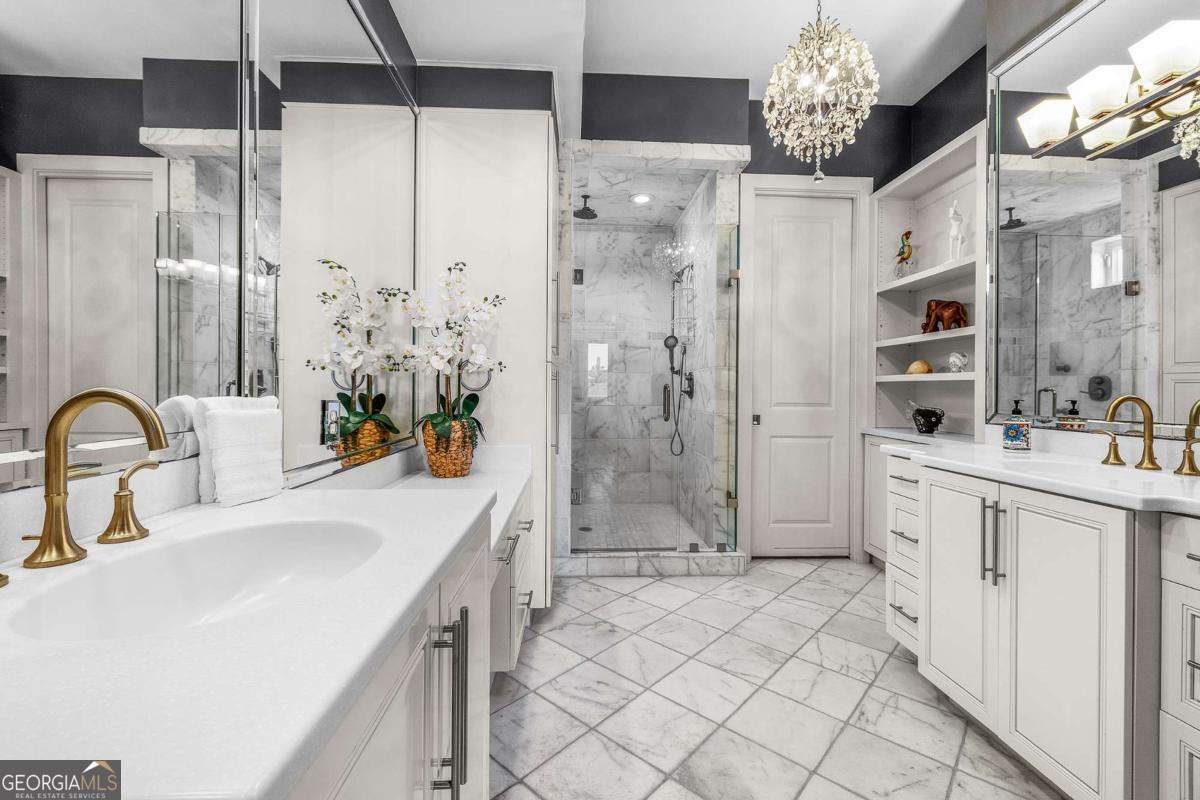 8 18th Street Tybee Island, GA 31328 - Photo 29 of 50 a bathroom with a double vanity sink mirror and shower