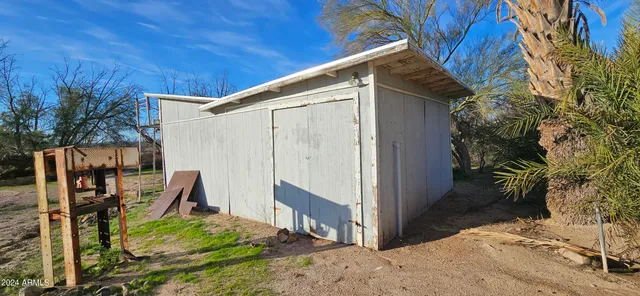 a view of a street with palm trees