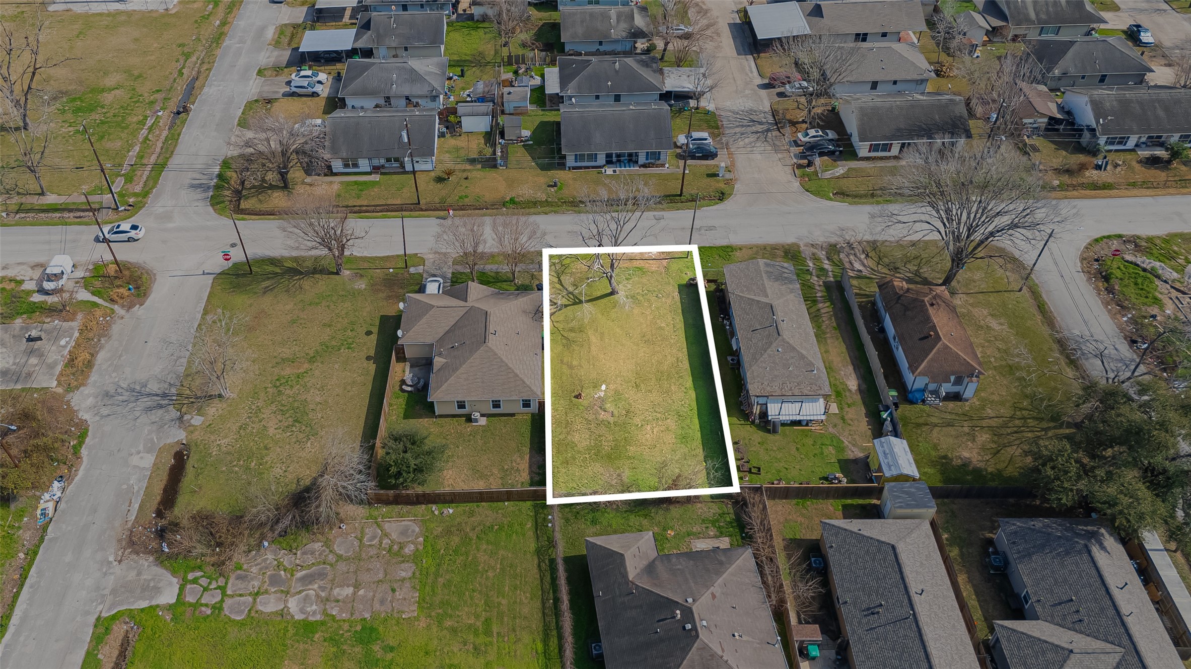 an aerial view of residential houses with outdoor space