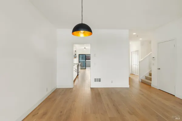 a large white bed in a white room