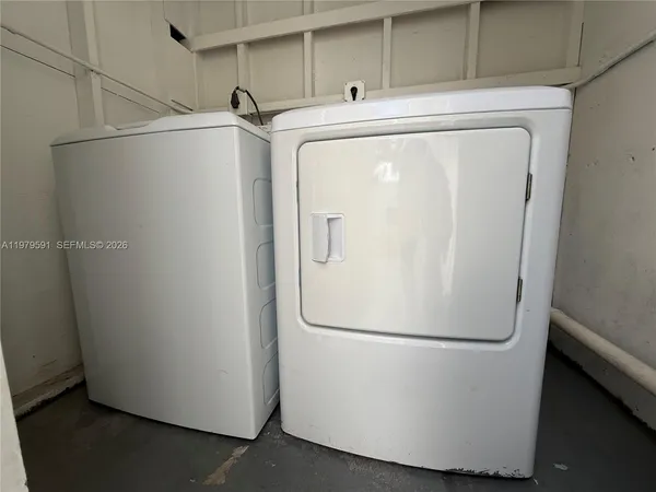 a white refrigerator freezer sitting in a kitchen