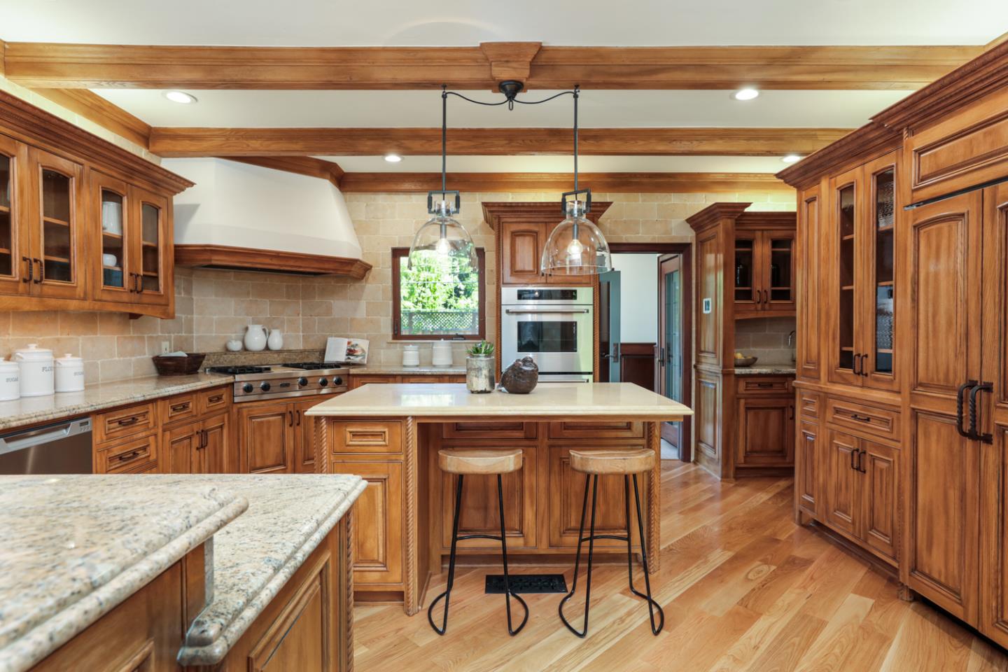 255 Lyell Street Los Altos, CA 94022 - Photo 20 of 50 a kitchen with a stove a refrigerator and a wooden cabinets