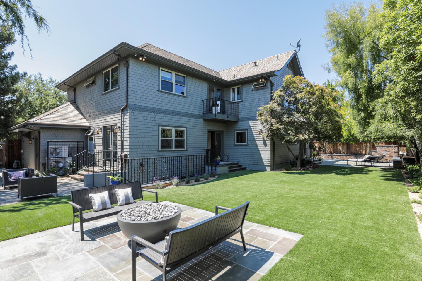 255 Lyell Street Los Altos, CA 94022 - Photo 26 of 50 a backyard of a house with fountain table and chairs