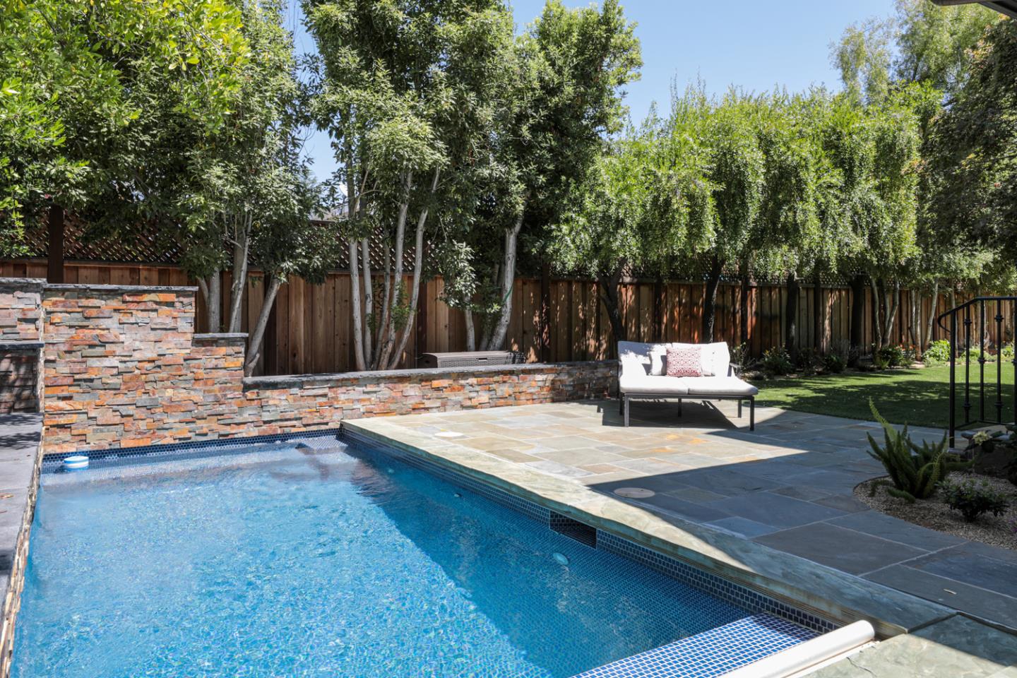 255 Lyell Street Los Altos, CA 94022 - Photo 29 of 50 a view of a bench in a backyard