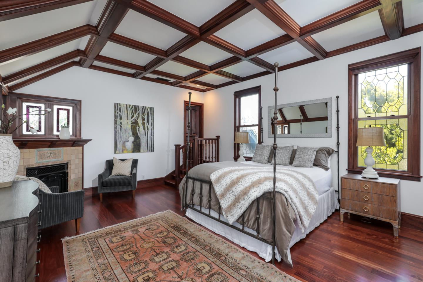 255 Lyell Street Los Altos, CA 94022 - Photo 32 of 50 a bed sitting in a bedroom next to a window with a fireplace