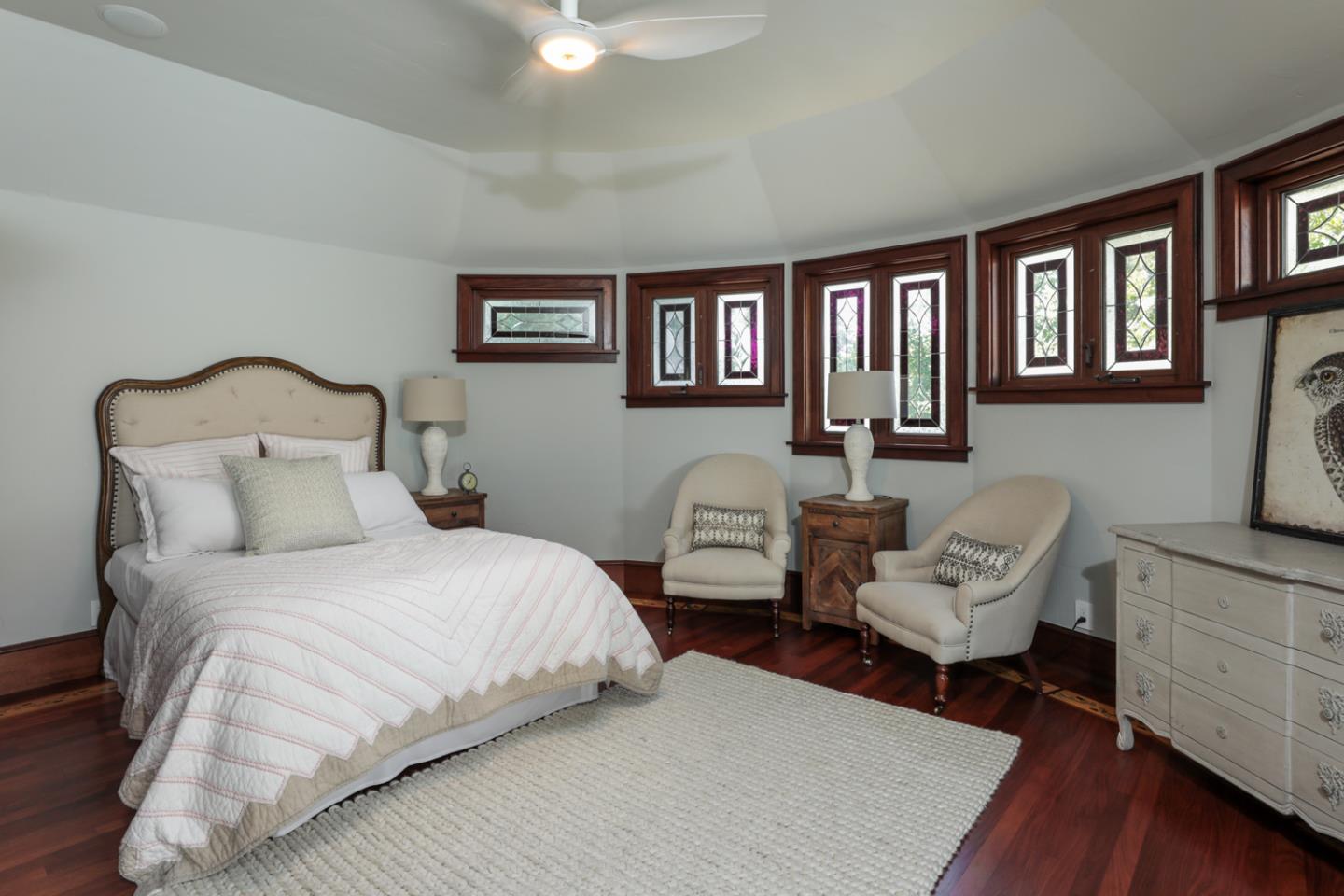 255 Lyell Street Los Altos, CA 94022 - Photo 44 of 50 a bedroom with a bed a couch and a bookshelf