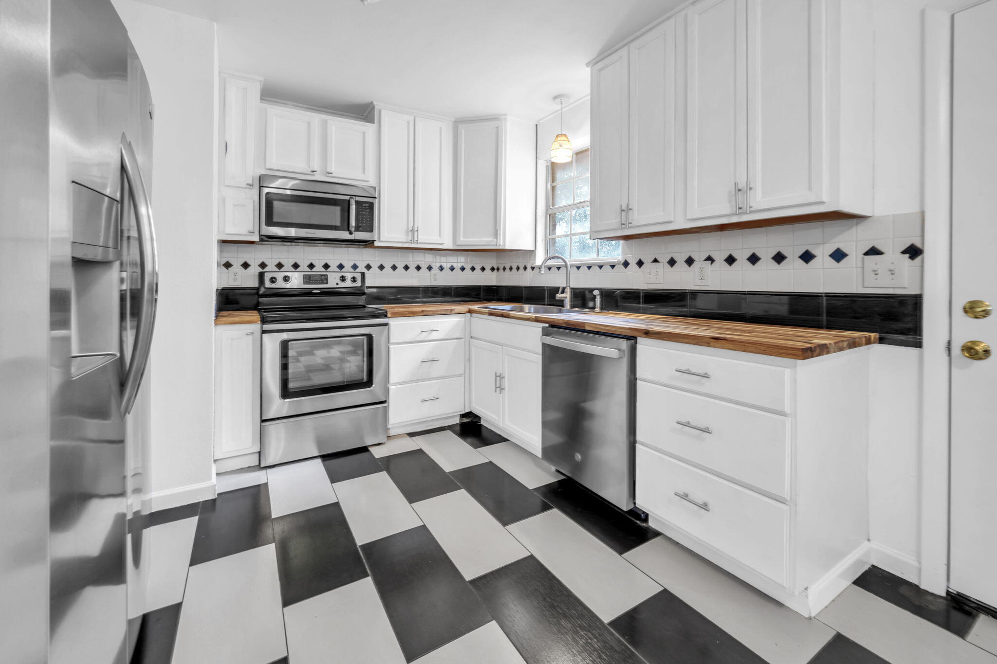 1020 Pinetree Road Mary Esther, FL 32569 - Photo 11 of 28 a kitchen with stainless steel appliances a stove a sink and a refrigerator