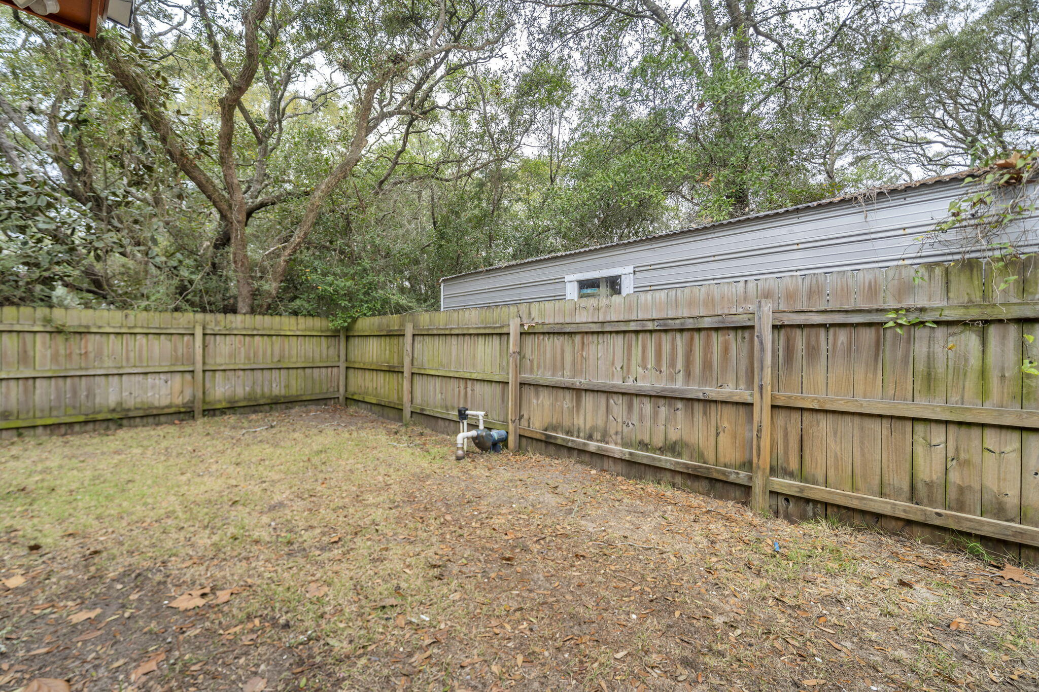 1020 Pinetree Road Mary Esther, FL 32569 - Photo 24 of 28 a backyard of a house with lots of green space