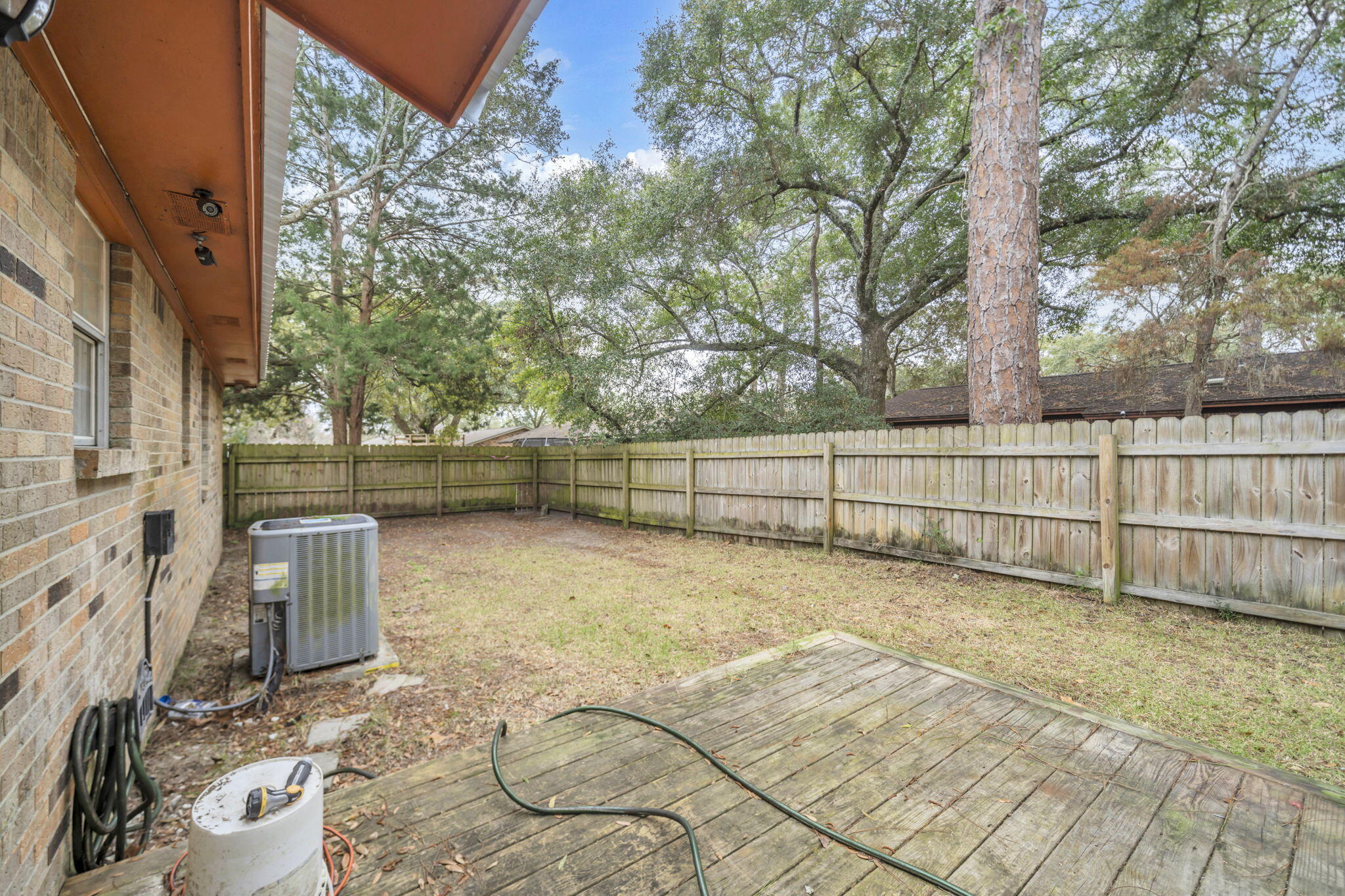 1020 Pinetree Road Mary Esther, FL 32569 - Photo 26 of 28 a view of backyard with wooden fence