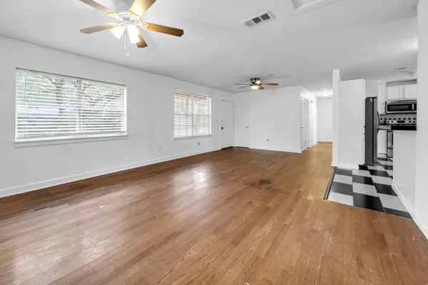 a view of a room with gym equipment and a window