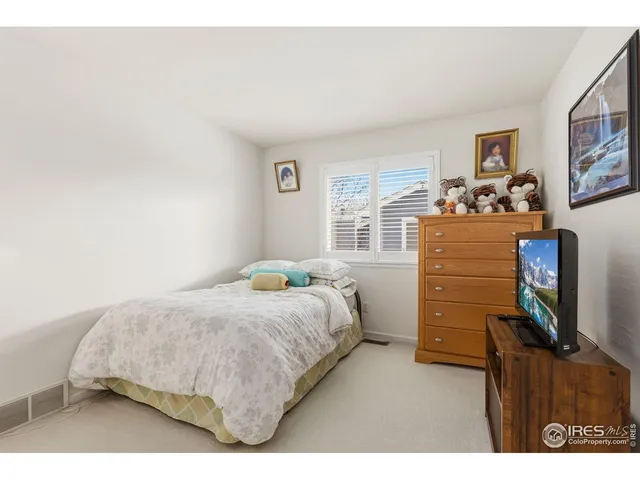 a bedroom with a bed and furniture