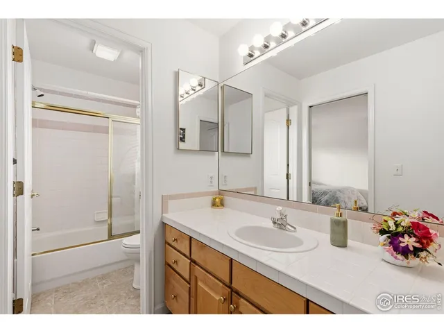 a bathroom with a sink double vanity and a mirror
