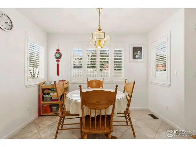 a view of a dining room with furniture and windows