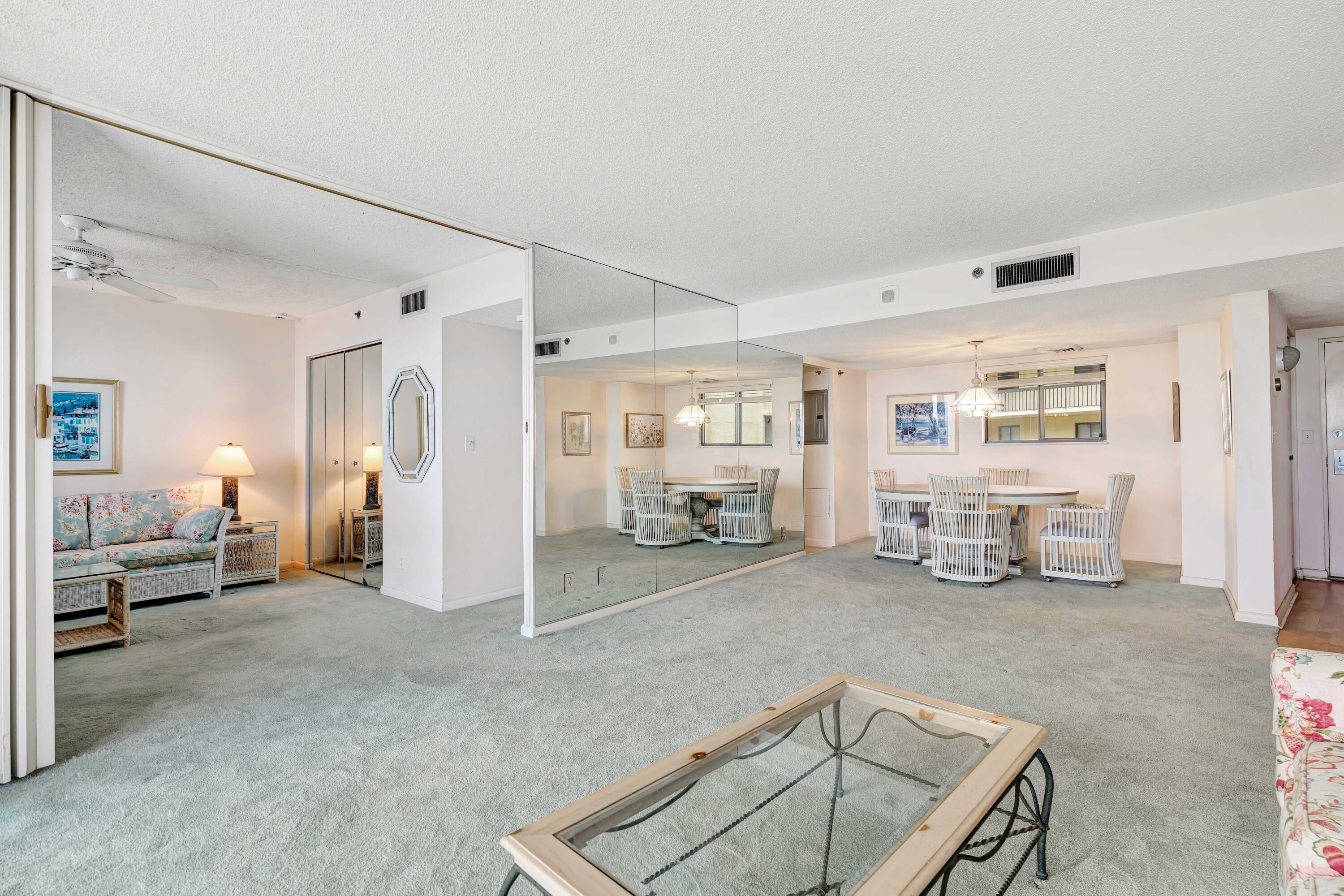 200 Ocean Trail Way, Unit 1009 Jupiter, FL 33477 - Photo 12 of 36 a view of a livingroom with furniture and windows cabinet