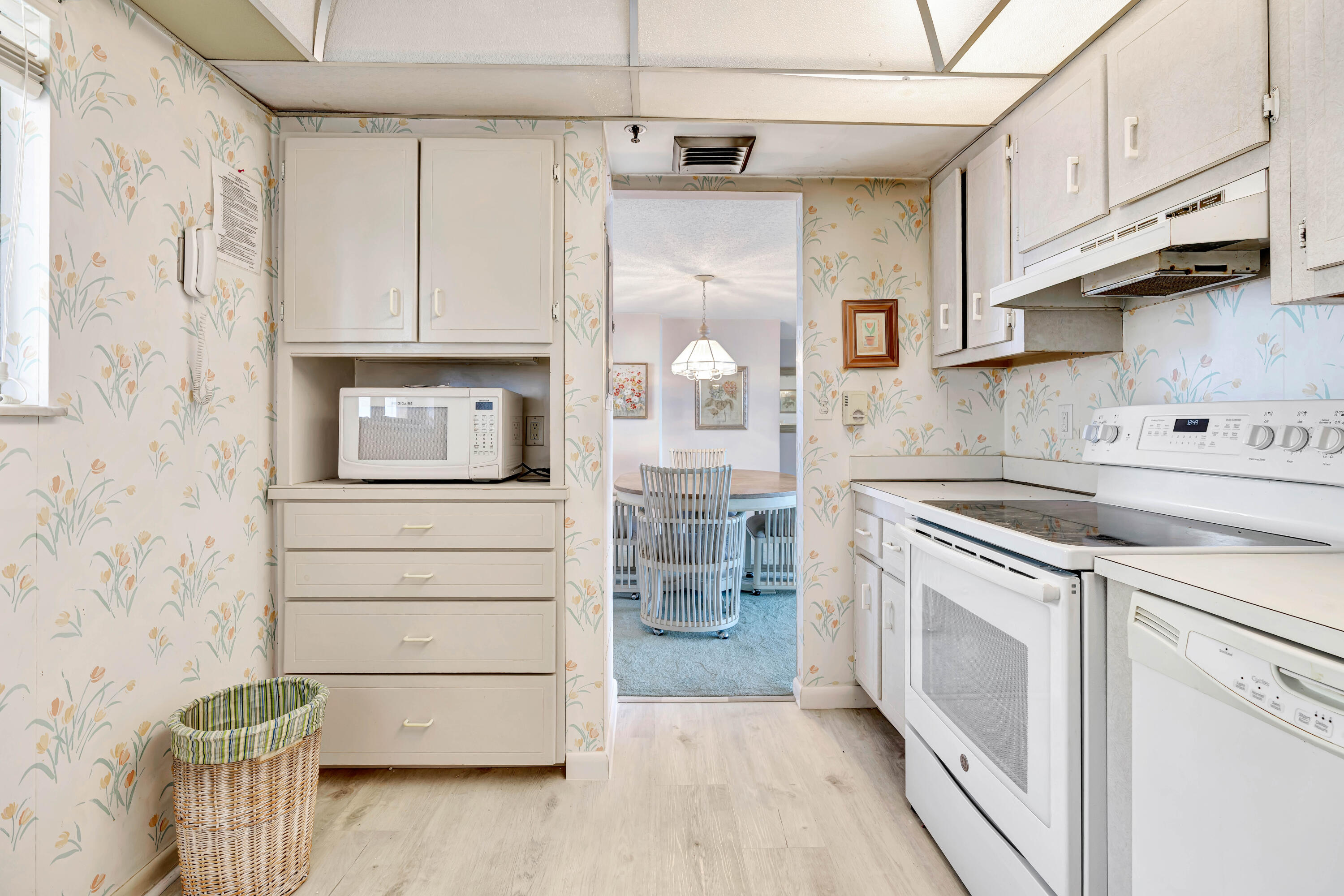 200 Ocean Trail Way, Unit 1009 Jupiter, FL 33477 - Photo 8 of 36 a kitchen with stainless steel appliances granite countertop a sink and a refrigerator