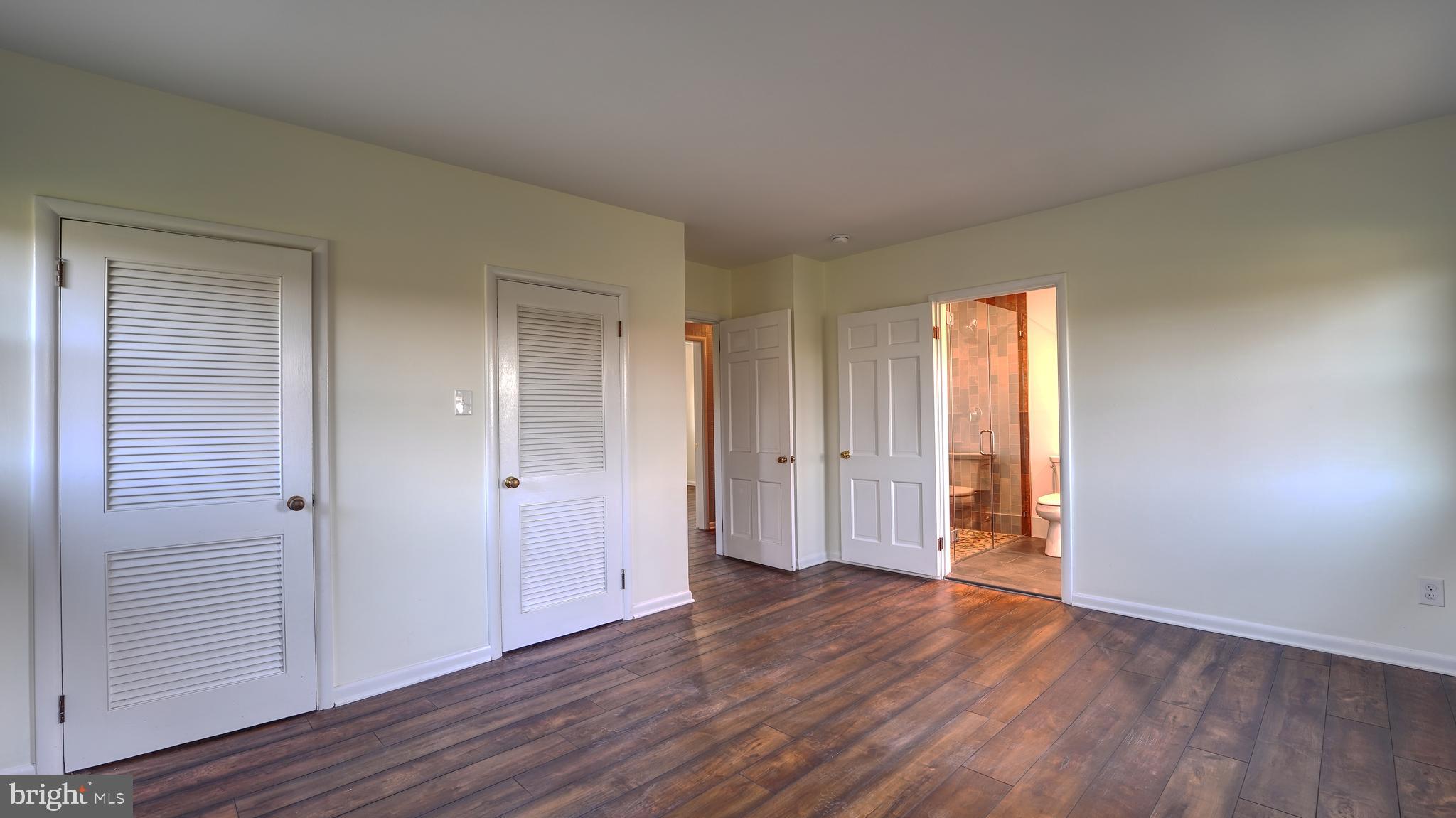 53 Iron Bridge Road Pipersville, PA 18947 - Photo 12 of 28 a view of an empty room with wooden floor and closet
