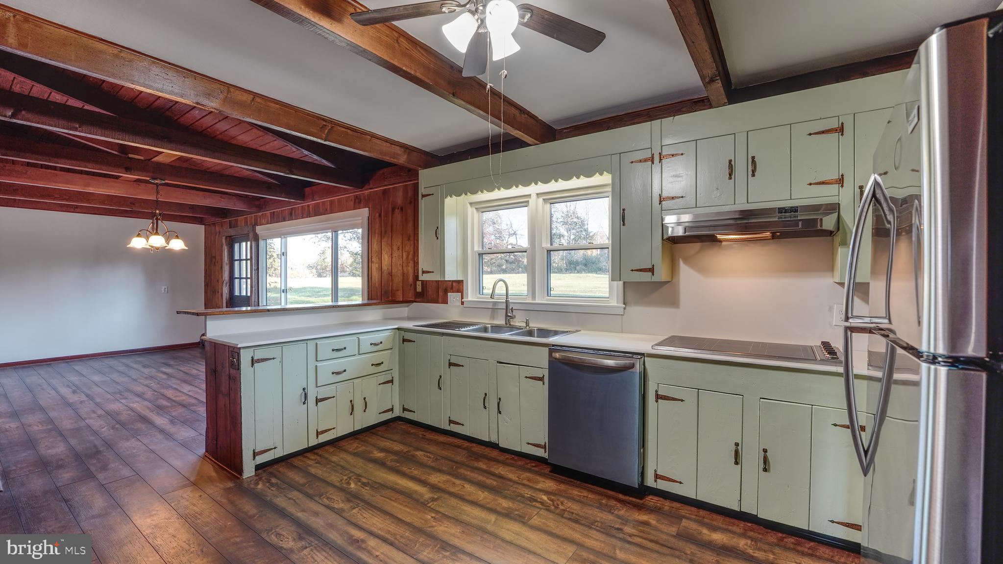 53 Iron Bridge Road Pipersville, PA 18947 - Photo 7 of 28 a kitchen with stainless steel appliances granite countertop a sink stove and refrigerator
